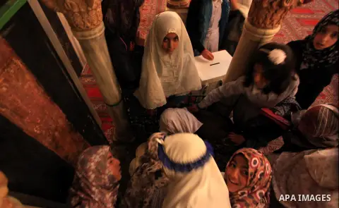 Palestinian girls pray at the Ibrahimi Mosque in the southern West Bank city of Hebron on February 25, 2014. On February 25, 1994, Israeli settler Baruch Goldstein used an assault rifle to gun down worshippers in the Ibr...
