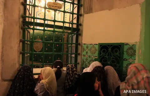 Palestinian girls visit the Ibrahimi Mosque in the southern West Bank city of Hebron on February 25, 2014. On February 25, 1994, Israeli settler Baruch Goldstein used an assault rifle to gun down worshippers in the Ibrah...