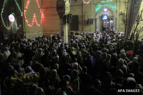 Worshippers attend the El Ishaa prayers at the Al-Hussein mosque, during celebration day of "Moulid Al-Hussein" the birthday of Prophet Mohammad's grandson Hussein in Cairo, February 25, 2014. Photo by Mohammed Bendari