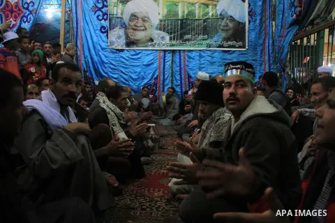 Worshippers attend the El Ishaa prayers at the Al-Hussein mosque, during celebration day of "Moulid Al-Hussein" the birthday of Prophet Mohammad's grandson Hussein in Cairo, February 25, 2014. Photo by Mohammed Bendari