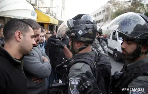 Israeli policemen arrest a Palestinian during clashes in East Jerusalem neighborhood Ras al-Amud, on March 01, 2014. Photo by Saeed Qaq