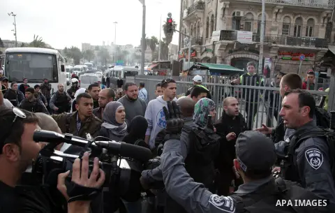 Israeli policemen arrest a Palestinian during clashes in East Jerusalem neighborhood Ras al-Amud, on March 01, 2014. Photo by Saeed Qaq