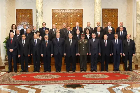 A handout photo made available by the Egyptian Presidency shows Egyptian interim President Adli Mansour (6-L, front row) posing for a group photo with the new government led by Prime Minister Ibrahim Mahlab (5-L, front r...