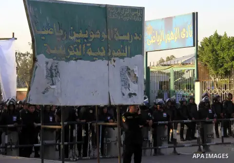 Egyptian security forces stand guard in front of the sports flowers club's headquarters in Cairo, capital of Egypt, on March 1, 2014. Photo by Mohammed Bendari