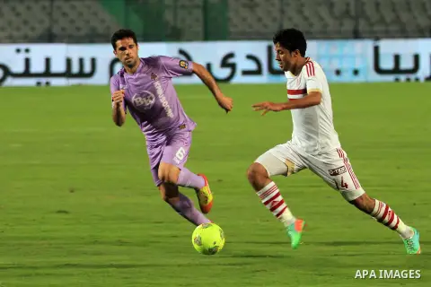Egyptian players of al-zamalek club compete with kabuscorp sport club during their African Cup soccer match at the sports flowers club's headquarters in Cairo, capital of Egypt, on March 1, 2014. Photo by Mohammed Bendar...