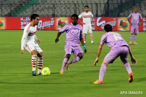 Egyptian players of al-zamalek club compete with kabuscorp sport club during their African Cup soccer match at the sports flowers club's headquarters in Cairo, capital of Egypt, on March 1, 2014. Photo by Mohammed Bendar...