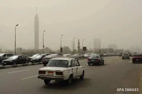 Cars drive during a sand storm in Cairo, Egypt, March 3, 2014. A sand storm hit Cairo on Sunday. Photo by Mohammed Bendari