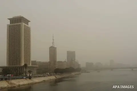 Buildings are engulfed in sand storm in Cairo, Egypt, March 3, 2014. A sand storm hit Cairo on Sunday. Photo by Mohammed Bendari