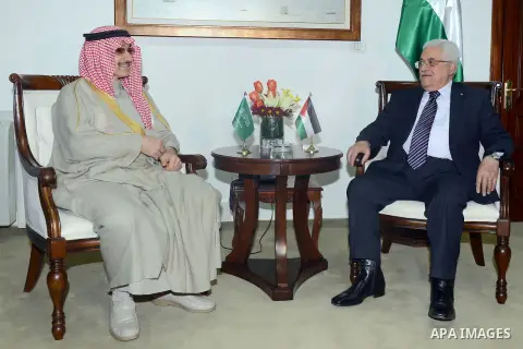 Palestinian President Mahmoud Abbas (R) meets with Saudi Arabia's prince Al-Waleed bin Talal in the West Bank city of Ramallah on March 4, 2014. Photo by Thaer Ganaim