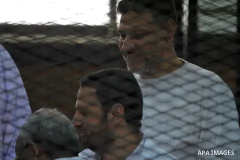 Egyptian members of Muslim Brotherhood during their trial in the case of blocking the road of Qalyub, in Cairo March 06, 2014. Criminal Court of Shubra Al Khaimah started to prosecute 48 defendants, including 12 leaders...