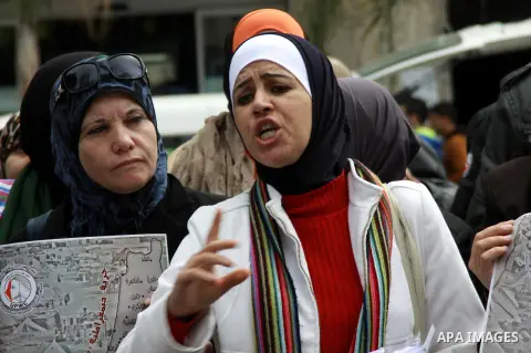 Palestinians chant during a protest to demand the boycott of the Israeli goods in the West bank city of Nablus, on March 09, 2014. Photo by Nedal Eshtayah
