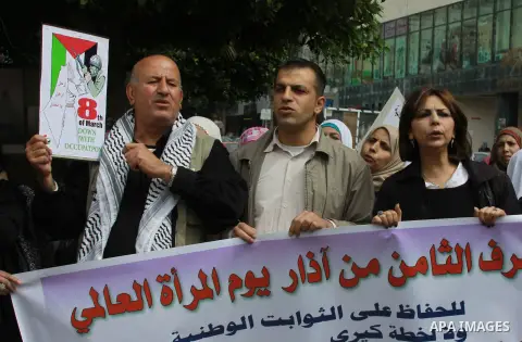 Palestinians chant during a protest to demand the boycott of the Israeli goods in the West bank city of Nablus, on March 09, 2014. Photo by Nedal Eshtayah
