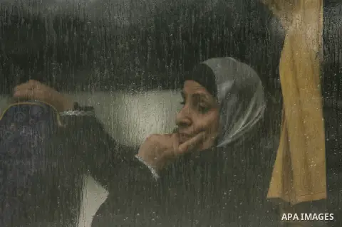 Palestinians, hoping to cross into Egypt, wait at the Rafah crossing between Egypt and the southern Gaza Strip on March 9, 2014. Egyptian authorities partially opened the Rafah crossing on Sunday for three days for passe...