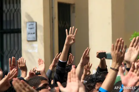 Egyptian students of Cairo University who support the Muslim Brotherhood and ousted Egyptian President Mohamed Mursi, take part in a demonstration against the military rule, in Cairo on March 09, 2014. Anti-coup students...