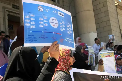 Egyptian students of the faculty of Pharmacy in the Cairo University hold placards during a demonstration calling for the release of their colleagues detained by the army-backed interim authorities, in Cairo March 10, 20...