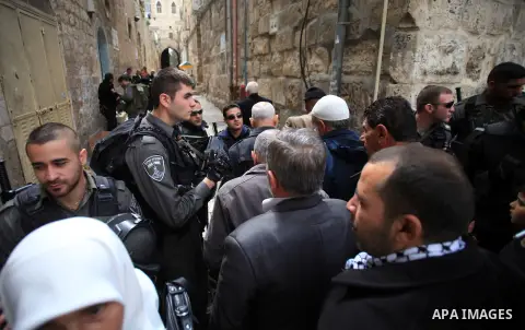 Israeli policemen stand guard as they try to prevent Palestinians from entering the al-Aqsa mosque compound, in Jerusalem's Old City on March 11, 2014. Israeli authorities on Tuesday closed a number of Al-Aqsa Mosque com...