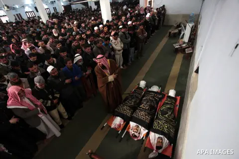 Palestinians pray next to the bodies of three Islamic Jihad militants, who were killed in an Israeli air strike, during their funeral at a mosque in Khan Younis in the southern Gaza Strip March 11, 2014. An Israeli air s...