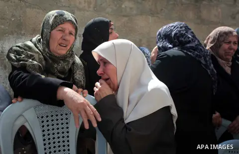 Relatives of Palestinian Kareem Hamad mourn during his funeral at Beit Hanoun on the northern Gaza Strip March 12, 2014. A blast in a second-storey apartment killed Hamad and other two militants belonging to a small Jiha...