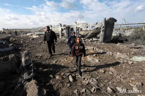 Palestinians inspect the scene of an Israeli air strike in Rafah in the southern of Gaza Strip March 14, 2014. A small armed faction in the Gaza Strip fired rockets at Israel on Thursday, drawing retaliatory air strikes...