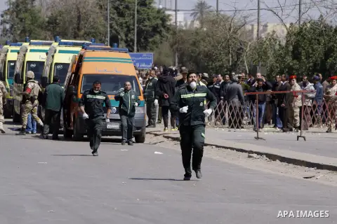 Egyptian soldiers and officials inspect the sight where gunmen killed six soldiers at a Cairo checkpoint on March 15, 2014 in an attack the military blamed on the Muslim Brotherhood movement of deposed president Mohamed...