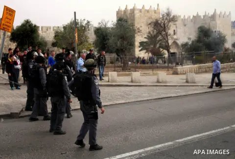 Israeli riot police stand guard during a demonstration in Jerusalem's Old City, 16 March 2014, when Palestinians were prevented from entering al-Aqsa Mosque for prayers. Earlier in the day protests took place inside the...