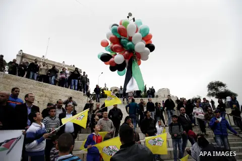 Palestinians take part in a rally in Jerusalem's Old City on March 17, 2014, to show their support for Palestinian president Mahmud Abbas who is on an official visit to the US capital, Washington DC. President Barack Oba...