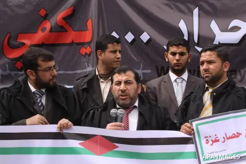 Palestinian lawyers take part a protest against the Egyptian-Israeli Blockade on Gaza strip, in front of the Egyptian Embassy in Gaza City, on March 18, 2014. Photo by Mohammed Asad