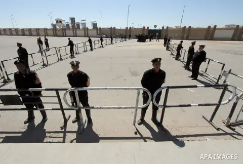 Egyptian security forces stand guard the police academy in Cairo, Egypt, on Feb. 19, 2014. Photo by Mohammed Bendari