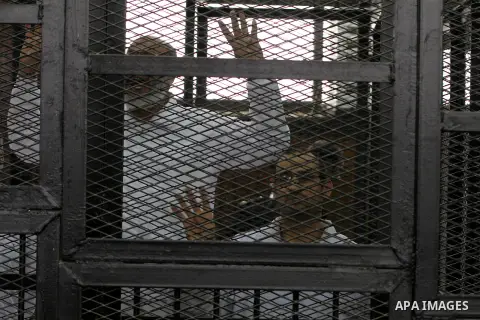 Egyptian members of Muslim Brotherhood during their trial in the case of Rabaa Al-Adaweya, in Cairo Egypt on March 23, 2014. Photo by Mohammed Bendari