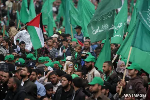 Palestinian Hamas supporters take part in a Hamas rally marking the anniversary of the death of its leaders killed by Israel, in Gaza City March 23, 2014. Photo by Ashraf Amra