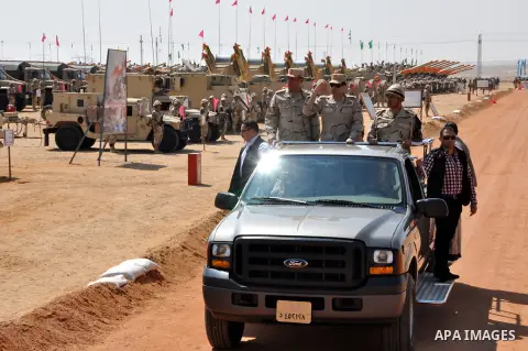 A handout picture released by the military moral affairs shows the Egypt's army chief, Field Marshal Abdel Fattah al-Sisi, inspects the unit of rapid deployment forces in the Egyptian army, in Cairo on March 25, 2014. ap...