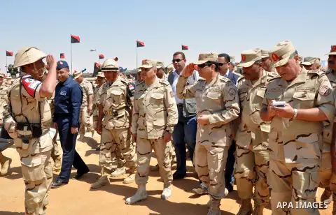 A handout picture released by the military moral affairs shows the Egypt's army chief, Field Marshal Abdel Fattah al-Sisi, inspects the unit of rapid deployment forces in the Egyptian army, in Cairo on March 25, 2014. ap...