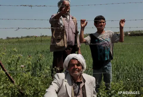 Palestinians take part in a rally marking Land Day in Beit Hanun in the northern Gaza Strip close to the border with Israel on March 27, 2014. The annual demonstrations mark the deaths of six Arab Israeli protesters at t...