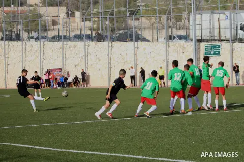 Palestinian Local players play with wahdat sport club from Jordan during their match, at Jerusalem city, on March 29, 2014. Palestinian Sakhnin players win in the International Cup of Jerusalem. Photo by Saeed Qaq