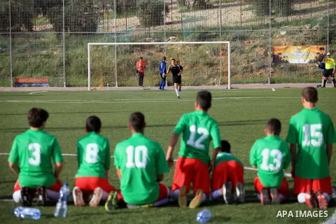 Palestinian Local players play with wahdat sport club from Jordan during their match, at Jerusalem city, on March 29, 2014. Palestinian Sakhnin players win in the International Cup of Jerusalem. Photo by Saeed Qaq