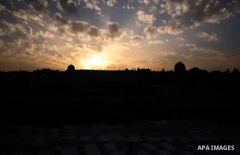 The Dome of the Rock mosque is seen during the sunset at the al-Aqsa mosque compound, Islam's third holiest site, in Jerusalem's Old City on April 01, 2014. Photo by Saeed Qaq