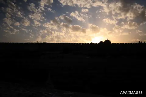 The Dome of the Rock mosque is seen during the sunset at the al-Aqsa mosque compound, Islam's third holiest site, in Jerusalem's Old City on April 01, 2014. Photo by Saeed Qaq