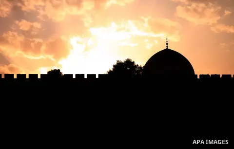 The Dome of the Rock mosque is seen during the sunset at the al-Aqsa mosque compound, Islam's third holiest site, in Jerusalem's Old City on April 01, 2014. Photo by Saeed Qaq