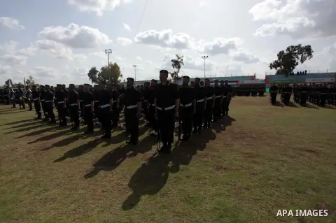 Palestinian members of security forces stand during a military graduation ceremony in Gaza City on April 02, 2014. Photo by Ashraf Amra