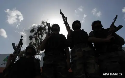 Palestinian members of security forces stand during a military graduation ceremony in Gaza City on April 02, 2014. Photo by Ashraf Amra