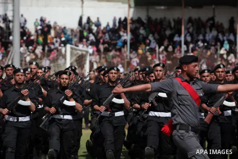 Palestinian members of security forces stand during a military graduation ceremony in Gaza City on April 02, 2014. Photo by Ashraf Amra