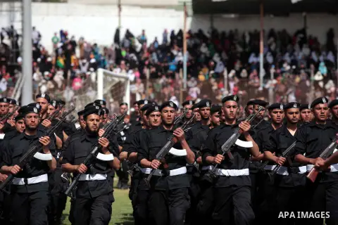 Palestinian members of security forces stand during a military graduation ceremony in Gaza City on April 02, 2014. Photo by Ashraf Amra