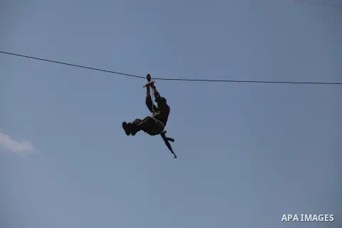 A Palestinian member of security forces demonstrates his skills during a military graduation ceremony in Gaza City on April 02, 2014. 1200 officers graduated from advanced training courses that lasted one year in Gaza po...