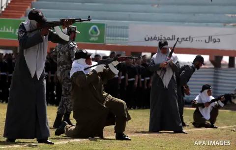 Female members of Palestinian security forces stand during a military graduation ceremony in Gaza City on April 02, 2014. 1200 officers graduated from advanced training courses that lasted one year in Gaza police academy...