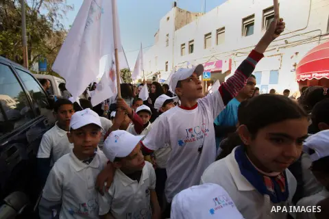 Palestinian children take part in a rally marking the World Autism Awareness Day in Jerusalem's Old City, April 02, 2014. The World Autism Awareness Day falls on April 2, drawing attention to the pervasive developmental...