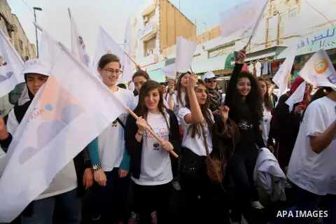 Palestinian children take part in a rally marking the World Autism Awareness Day in Jerusalem's Old City, April 02, 2014. The World Autism Awareness Day falls on April 2, drawing attention to the pervasive developmental...