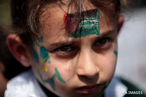 Palestinian children take part in a rally marking the Children's Day during a protest against Israeli blockade on Gaza strip in Gaza city, on April 05, 2014. Photo by Ashraf Amra