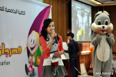 Palestinian children take part in a celebration to mark the International Children Day in Gaza city on April, 06, 2014. Photo by Mohammed Talatene