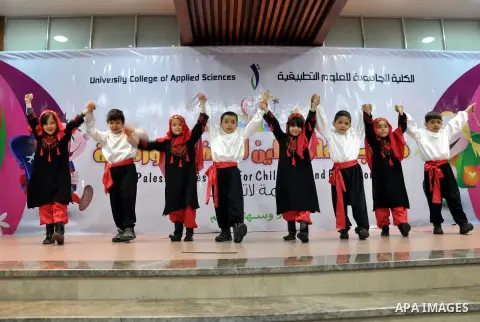 Palestinian children take part in a celebration to mark the International Children Day in Gaza city on April, 06, 2014. Photo by Mohammed Talatene