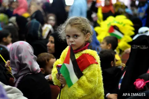Palestinian children take part in a celebration to mark the International Children Day in Gaza city on April, 06, 2014. Photo by Mohammed Talatene